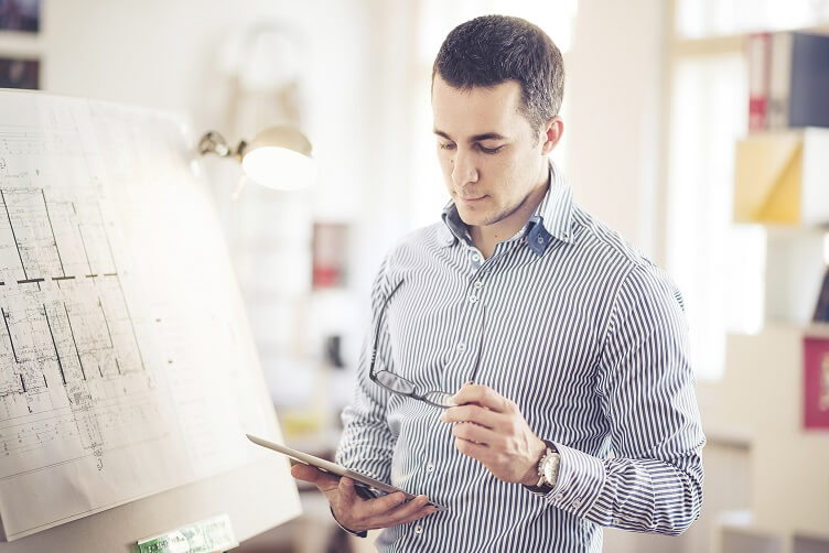 Architect Working On Blueprint